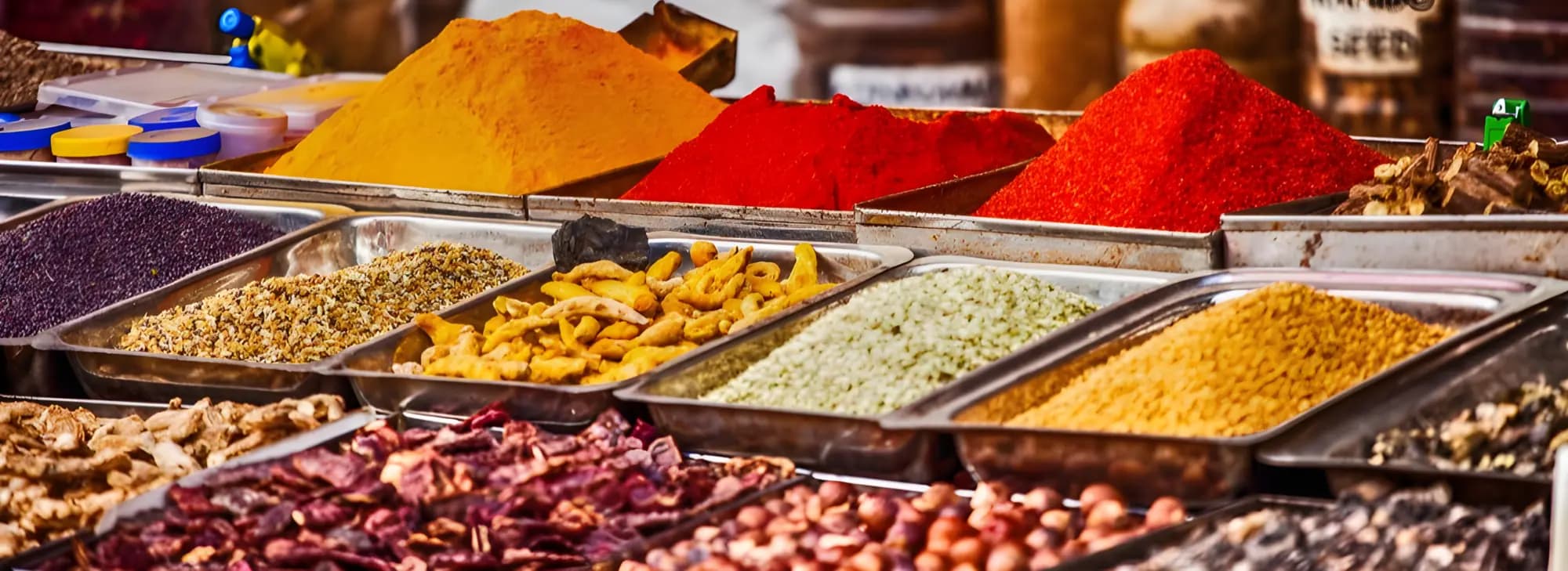 Various bowls filled with spices and herbs, displaying a rich palette of colors and inviting aromas.