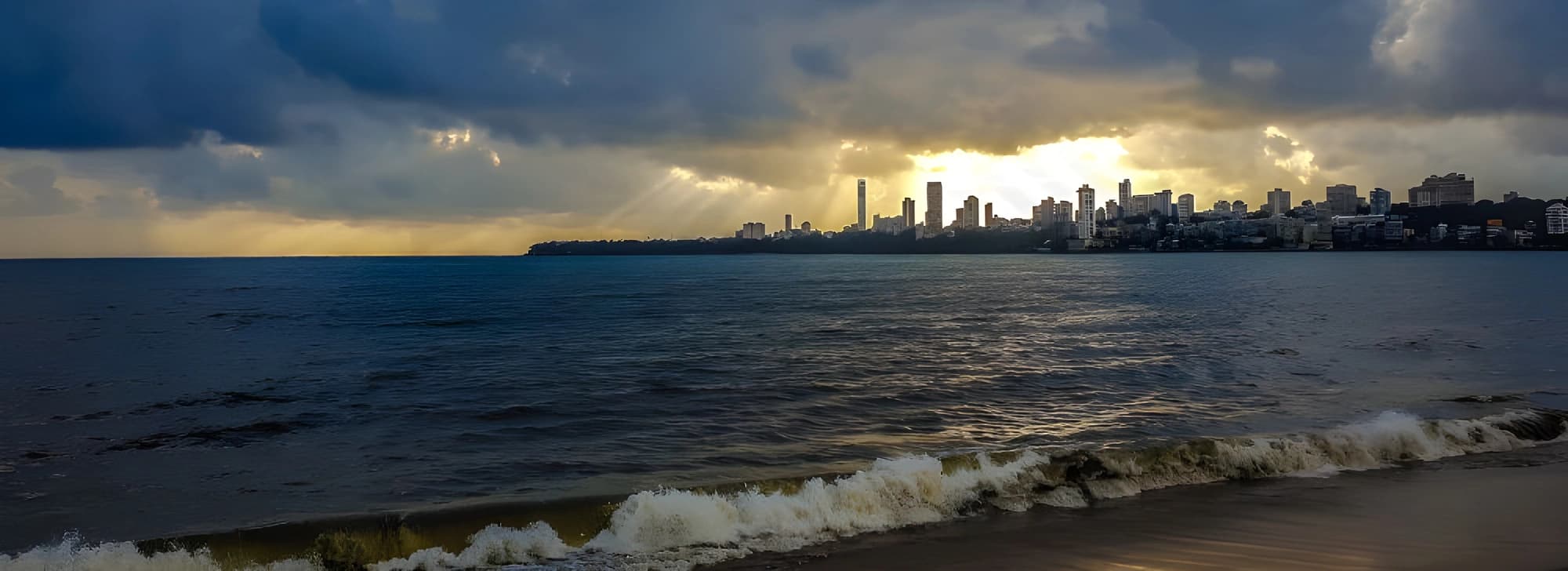 The skyline of Mumbai stands out against a cloudy sky, capturing the essence of the city in a dramatic atmospheric setting.