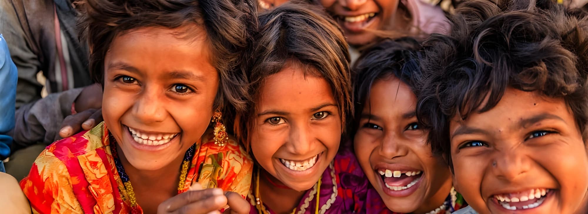A joyful group of children in Mumbai, smiling and laughing together, capturing the essence of friendship and happiness.