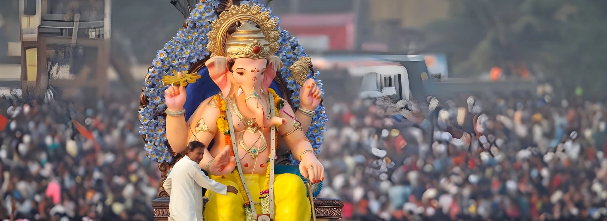 A gigantic view of Ganesh Utsav with a large crowd in the bustling city of Mumbai